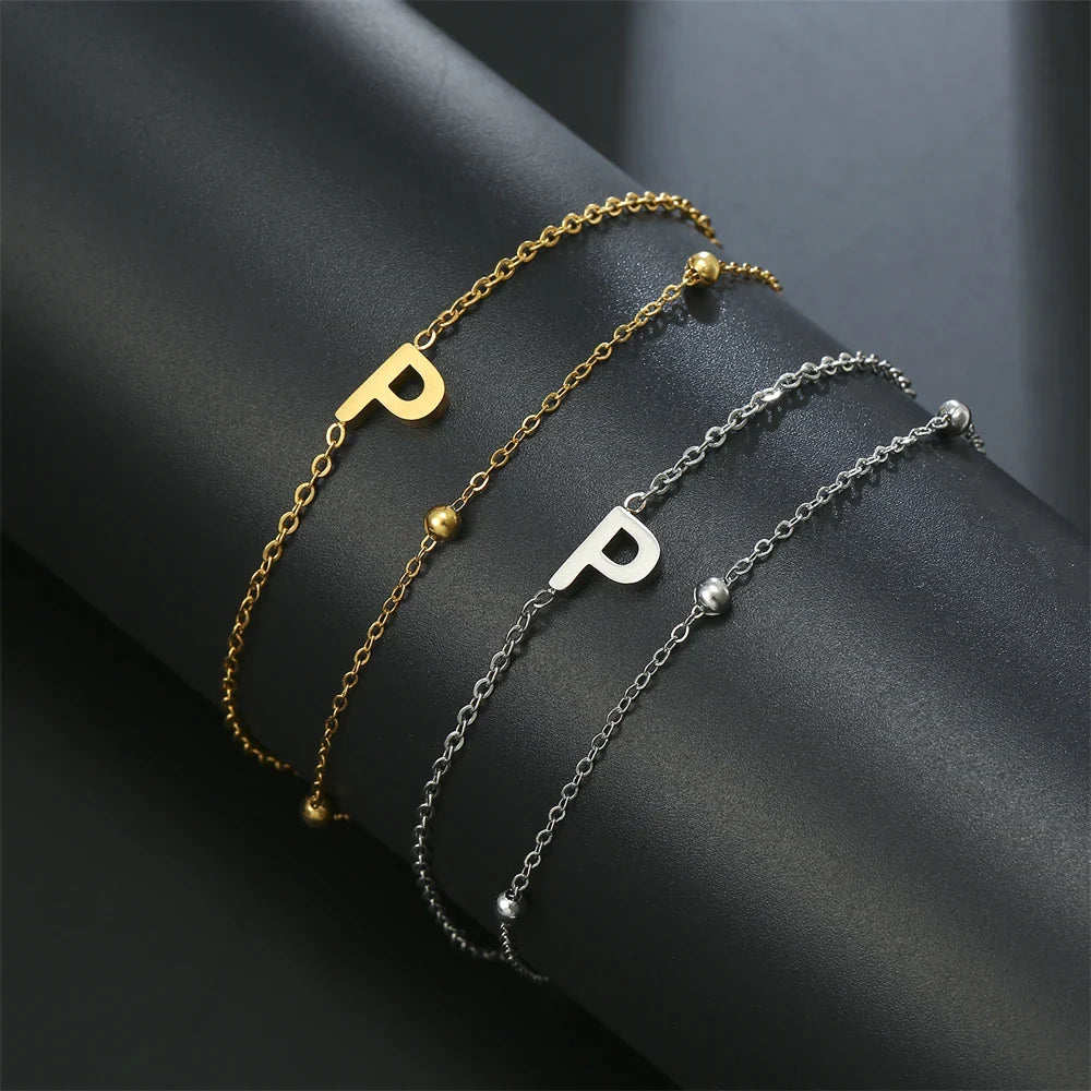 Armband mit doppelter Initiale in Gold und Silber  p