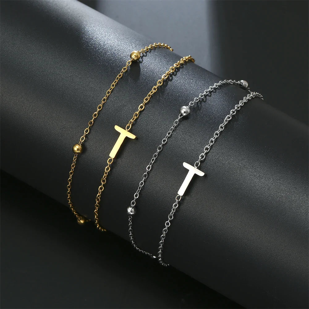 Armband mit doppelter Initiale in Gold und Silber  t