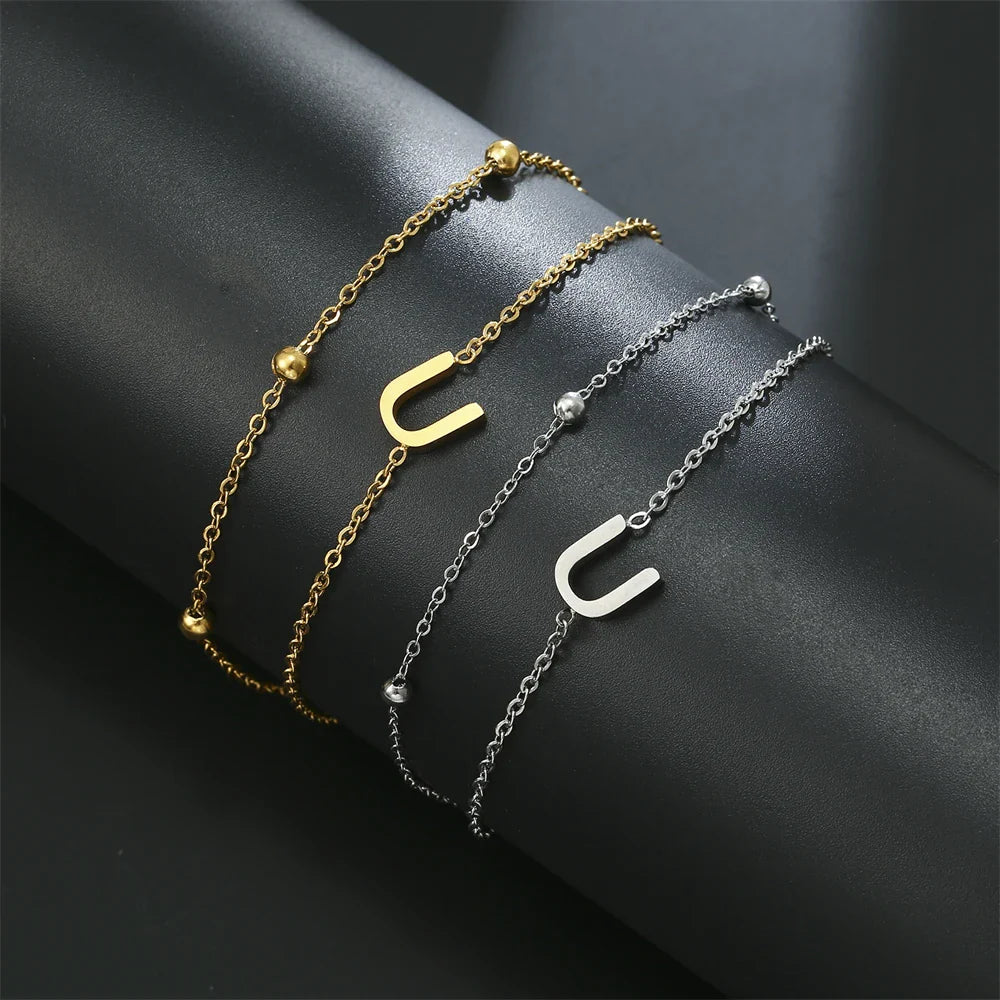 Armband mit doppelter Initiale in Gold und Silber  u