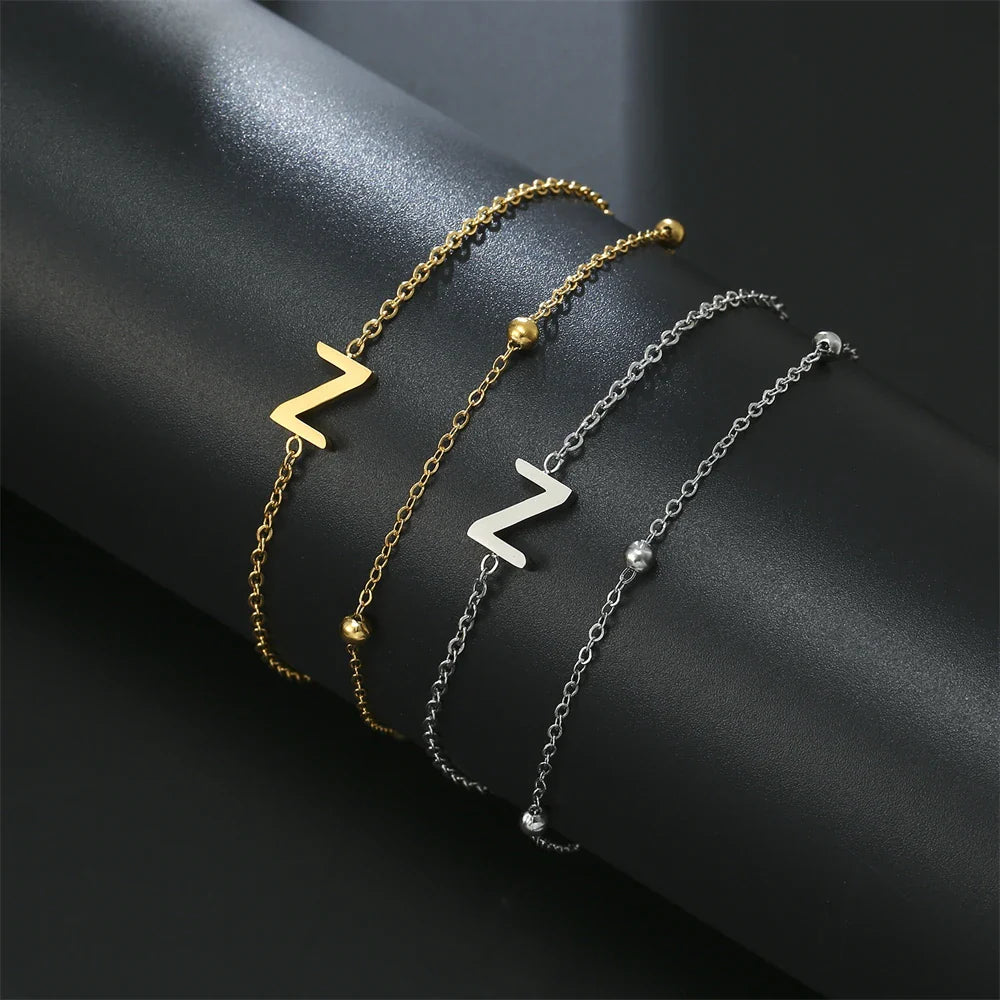 Armband mit doppelter Initiale in Gold und Silber  z