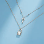 Doppelkette mit Schlüssel- und Vorhängeschloss-Anhänger in Silber