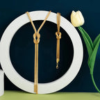 Langer Dekolleté-Halskette & Knotenarmband 