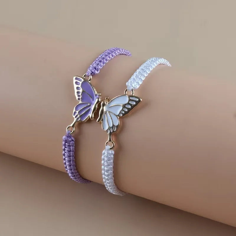 Set mit 2 Schmetterlingsflügel-Armbändern für beste Freunde in Violett und Weiß