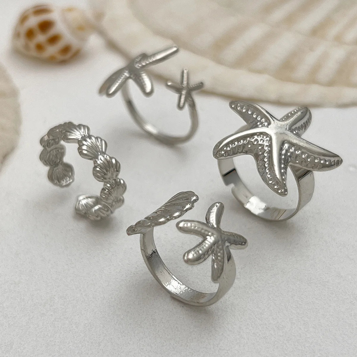 4er-Set Muschel- und Seesterne-Ringe in Silber