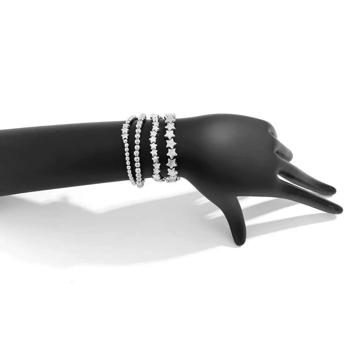 Set mit 4 silbernen Sternarmbändern