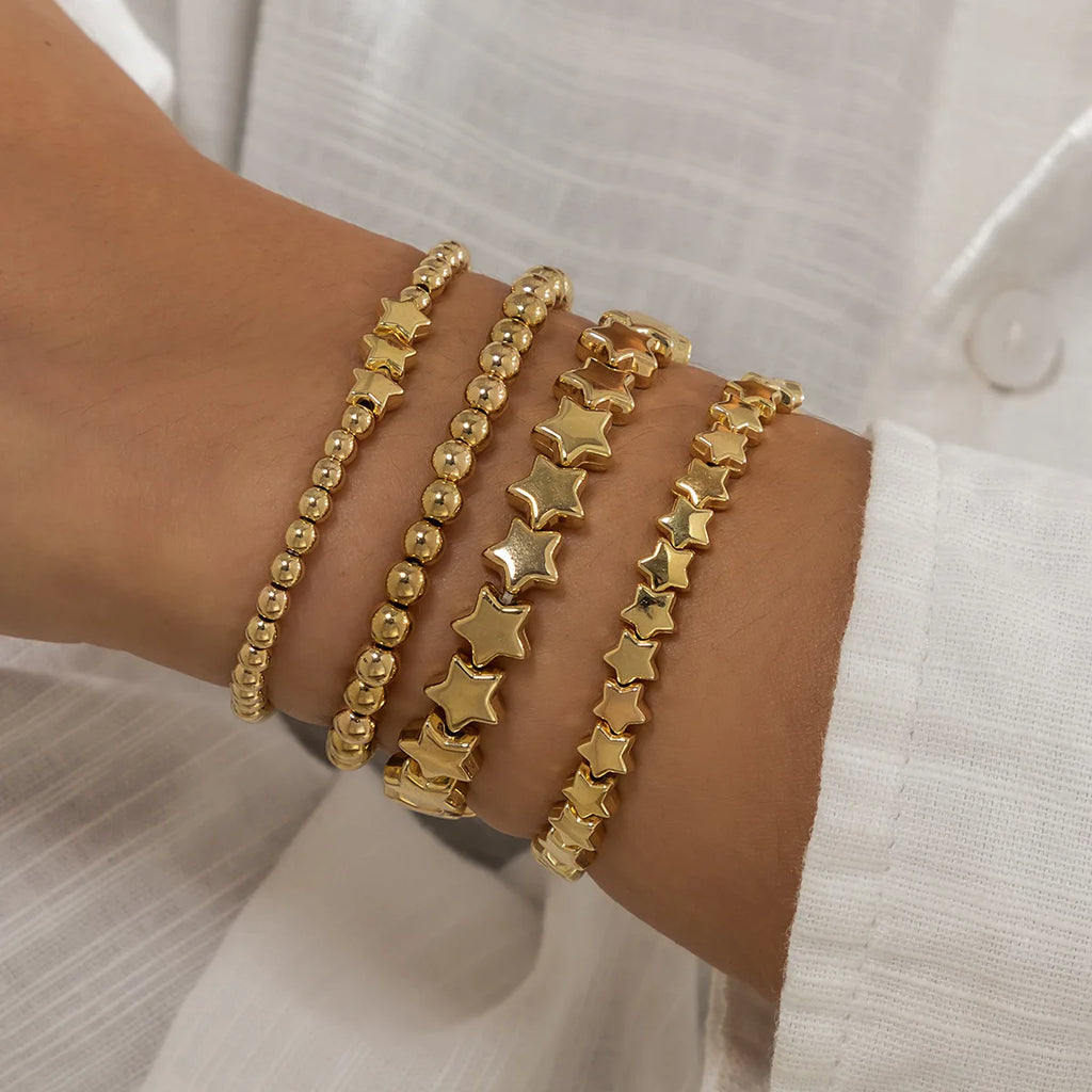 Set mit 4 goldenen Sternarmbändern