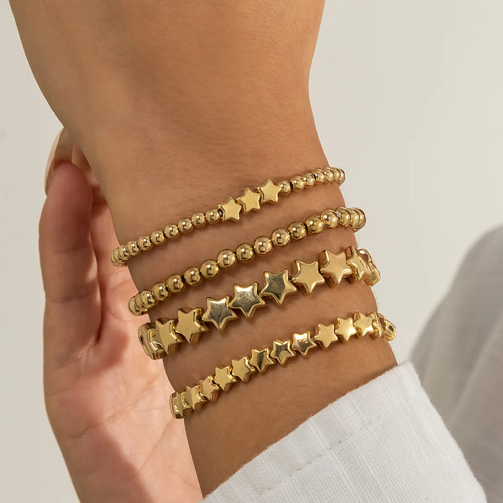 Set mit 4 goldenen Sternarmbändern