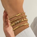 Set mit 4 goldenen Sternarmbändern